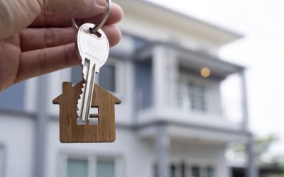 Landlord unlocks the house key for new home.  Real Estate Agents, Sales Agents concept.